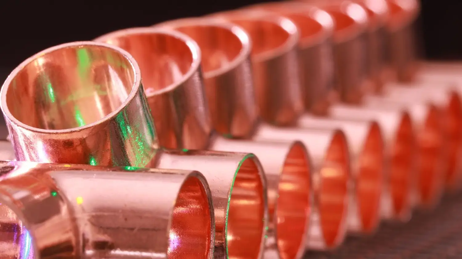 Copper plumbing fittings lined up