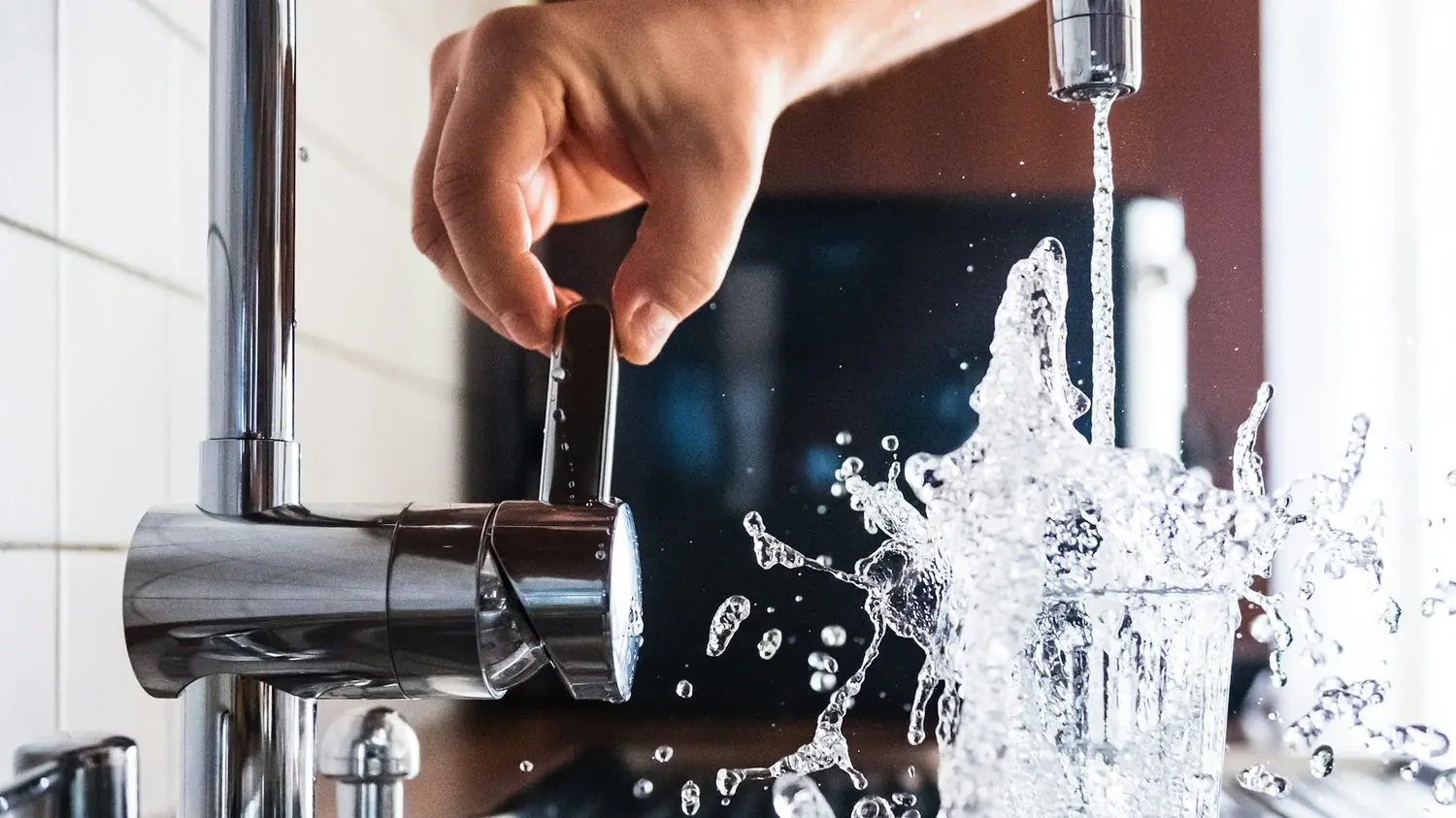 Water running from a kitchen faucet